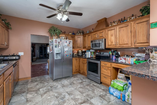 kitchen with ceiling fan and appliances with stainless steel finishes