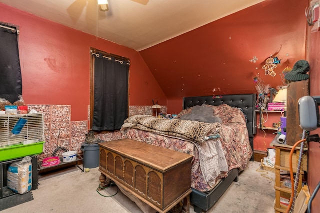 bedroom featuring lofted ceiling, light colored carpet, and ceiling fan