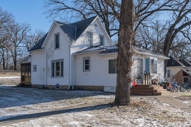 view of front facade featuring a sunroom