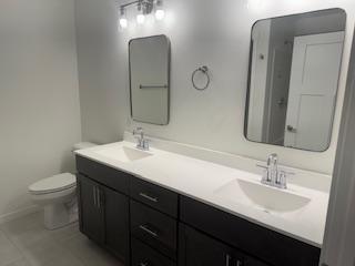 bathroom featuring vanity and toilet