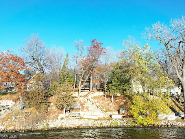 birds eye view of property featuring a water view