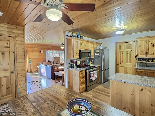 kitchen with a ceiling fan, light brown cabinets, stainless steel appliances, and wood ceiling