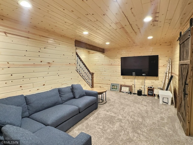 living area featuring a barn door, wood walls, carpet floors, and recessed lighting