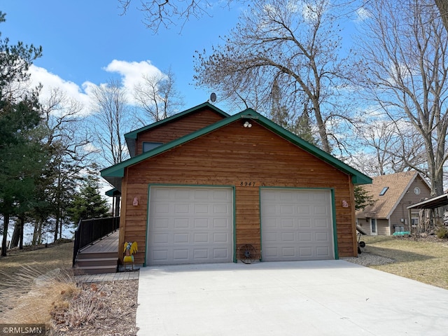 garage with concrete driveway