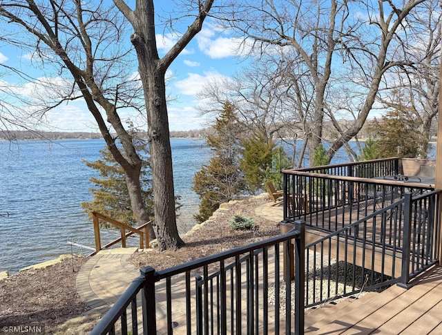 wooden terrace with a water view