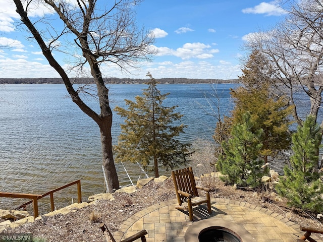 property view of water with an outdoor fire pit