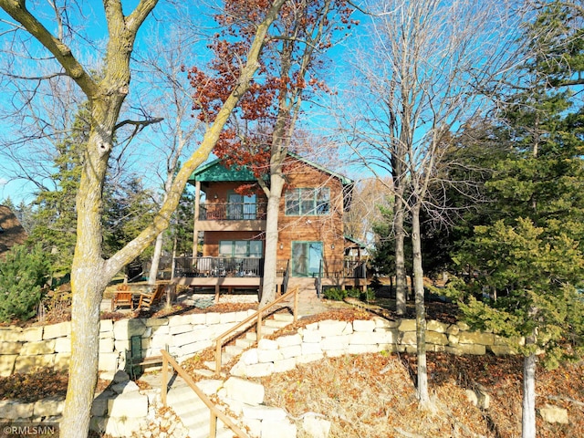 rear view of house with a balcony