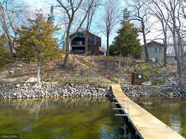 view of dock with stairs and a water view