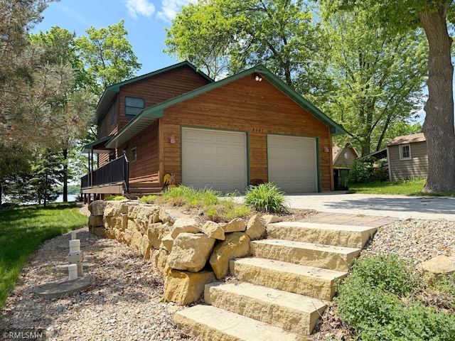 8947 Ingram Ave NW, Annandale, MN 55302 - view of front of property with a garage and driveway