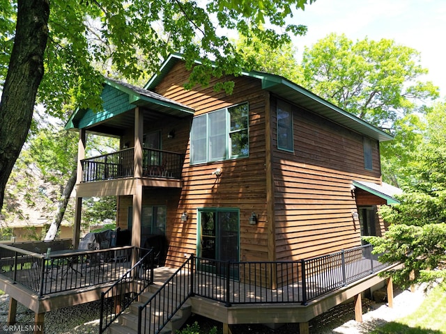 8947 Ingram Ave NW, Annandale, MN 55302 - view of property exterior featuring a balcony and a wooden deck