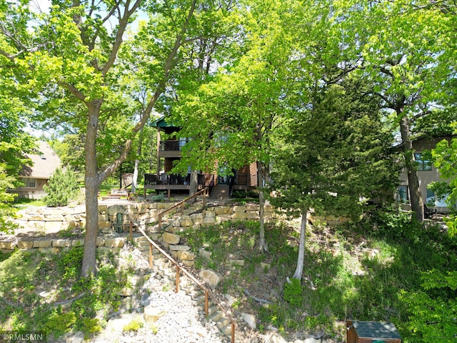8947 Ingram Ave NW, Annandale, MN 55302 - view of yard featuring stairway and a wooden deck
