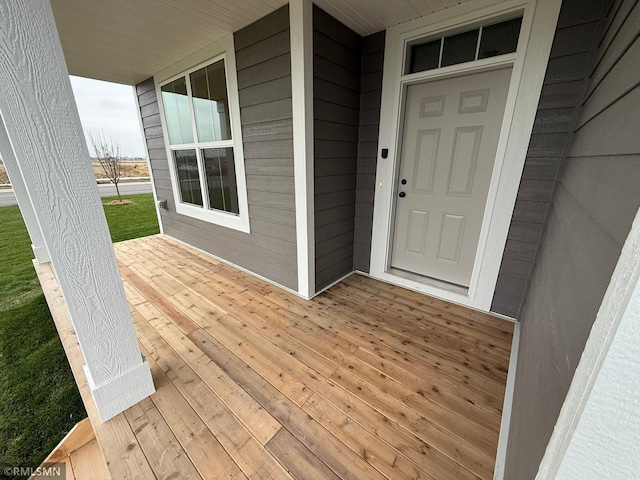 doorway to property with covered porch