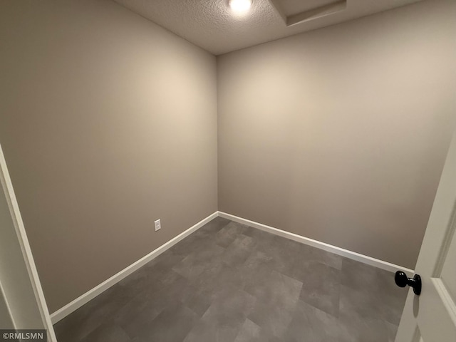 empty room with a textured ceiling