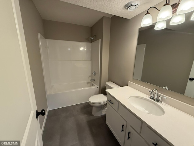 full bathroom with vanity, toilet, washtub / shower combination, and a textured ceiling