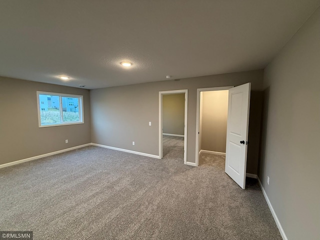 unfurnished bedroom with carpet flooring