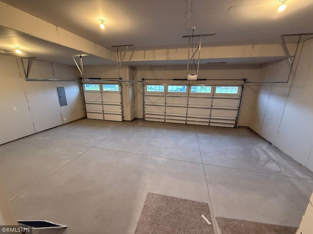 garage featuring a garage door opener and electric panel