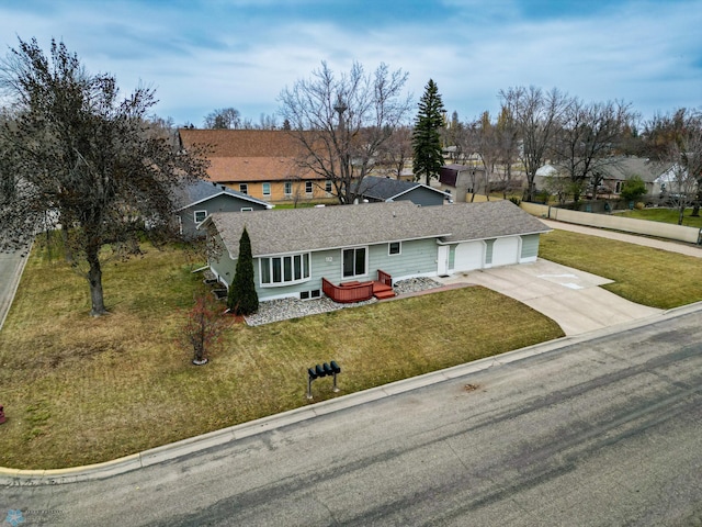 view of front of home featuring a front yard and a garage