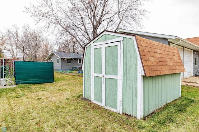 view of outdoor structure with a lawn