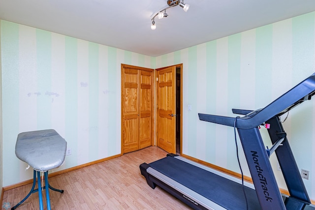 exercise area featuring light wood-type flooring