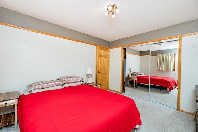 carpeted bedroom with a closet