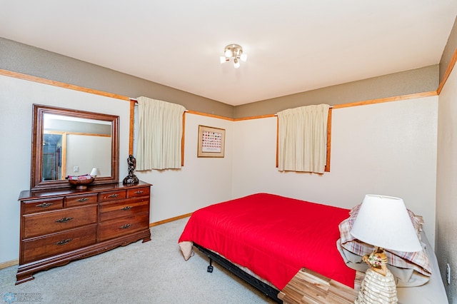 bedroom featuring light carpet