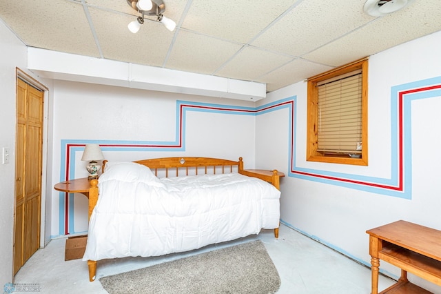 bedroom with a paneled ceiling