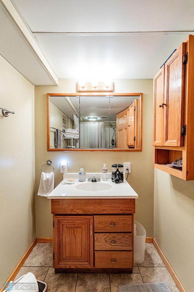 bathroom with tile patterned floors and vanity