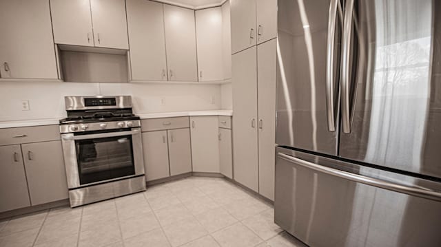 kitchen featuring appliances with stainless steel finishes and gray cabinetry