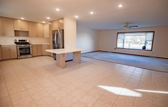 kitchen featuring ceiling fan and appliances with stainless steel finishes