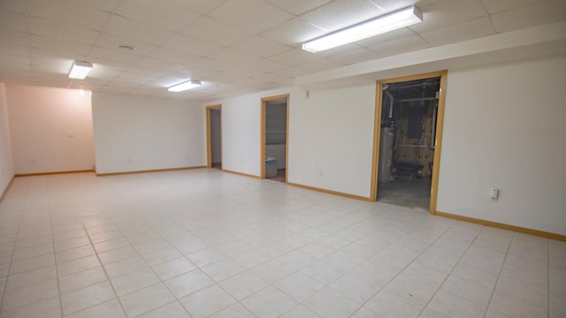 spare room featuring a paneled ceiling