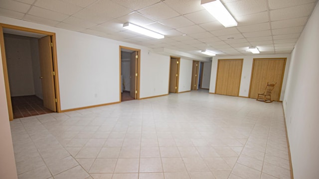 spare room featuring a paneled ceiling