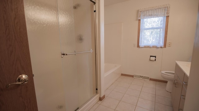 full bathroom featuring vanity, tile patterned flooring, plus walk in shower, and toilet