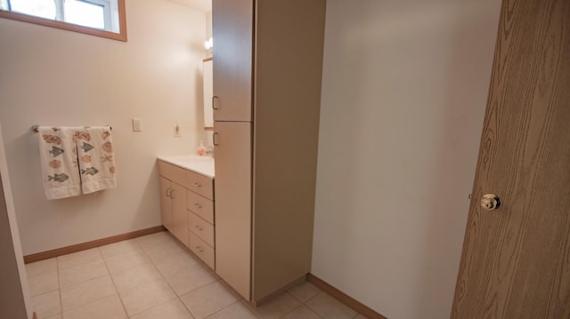 bathroom with tile patterned floors and vanity