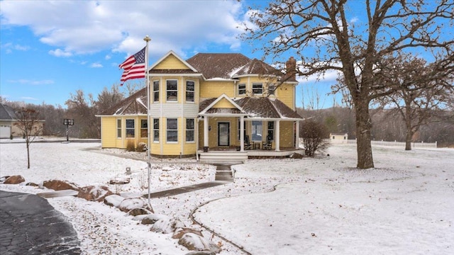 victorian house featuring a porch