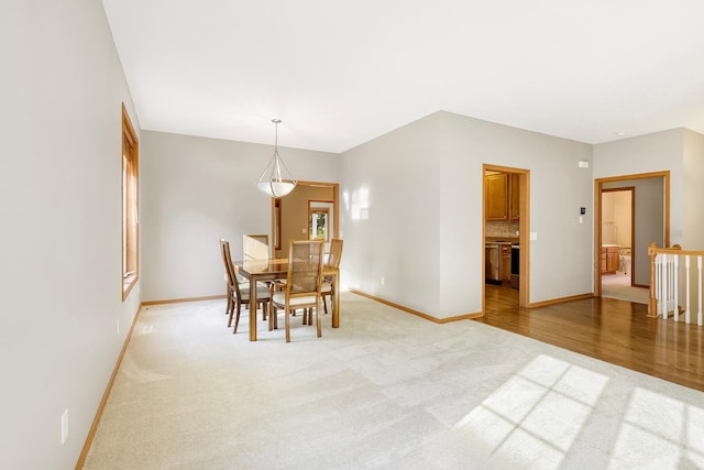 view of carpeted dining area