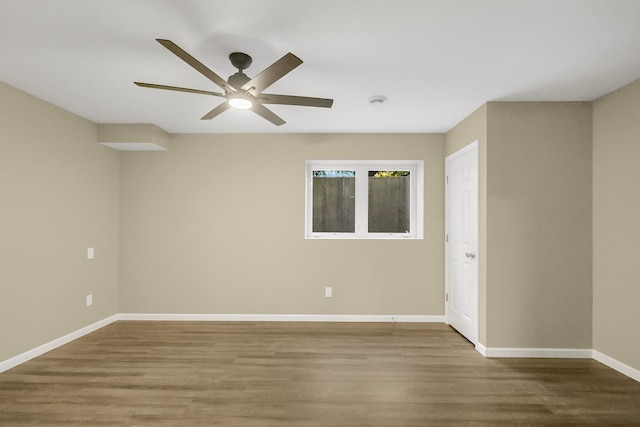 unfurnished room featuring ceiling fan and hardwood / wood-style flooring