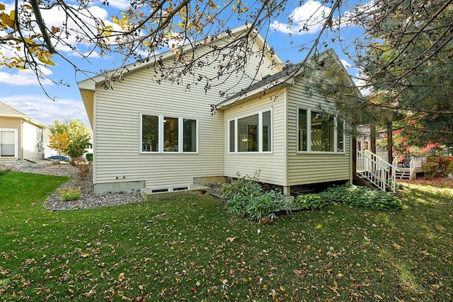 rear view of house with a lawn