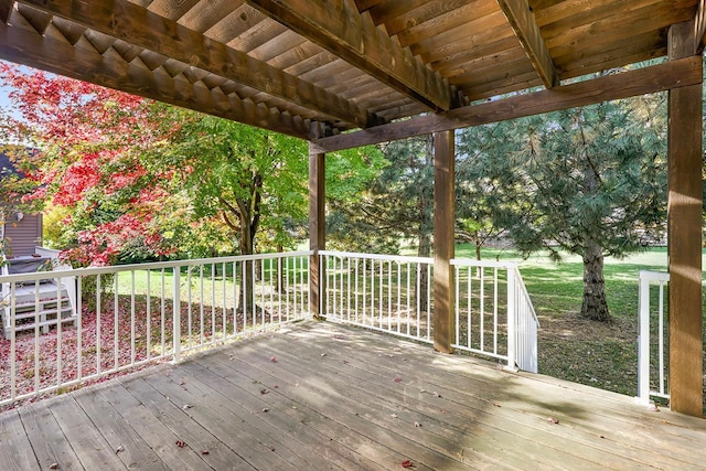 wooden deck with a yard