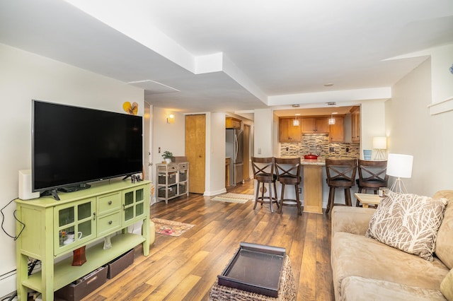 living room with dark hardwood / wood-style flooring