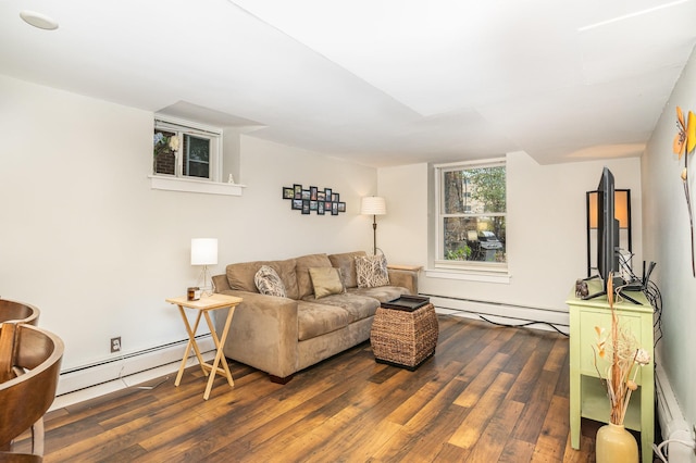 living room with dark hardwood / wood-style flooring and a baseboard heating unit