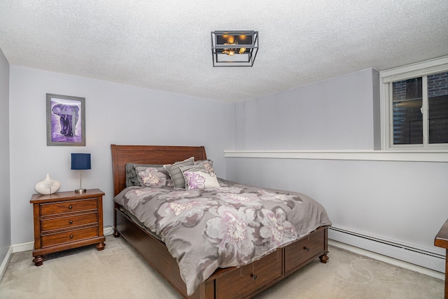 bedroom with light colored carpet, a textured ceiling, and a baseboard heating unit