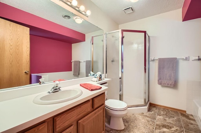 full bathroom featuring vanity, separate shower and tub, a textured ceiling, and toilet