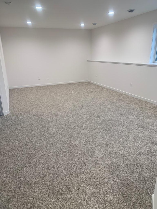 carpeted spare room with recessed lighting and baseboards