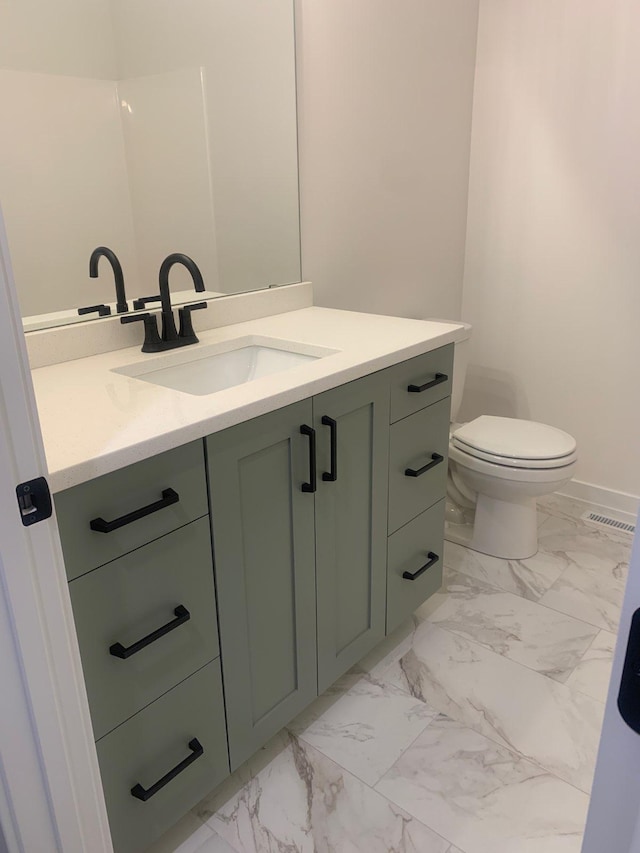 half bath with vanity, toilet, visible vents, and marble finish floor