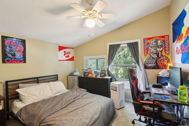 bedroom featuring a textured ceiling, ceiling fan, carpet, and lofted ceiling