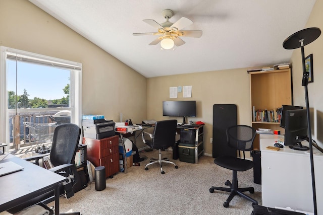 office space featuring ceiling fan, light colored carpet, and lofted ceiling