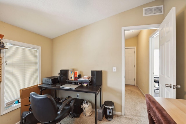 office area with carpet and lofted ceiling