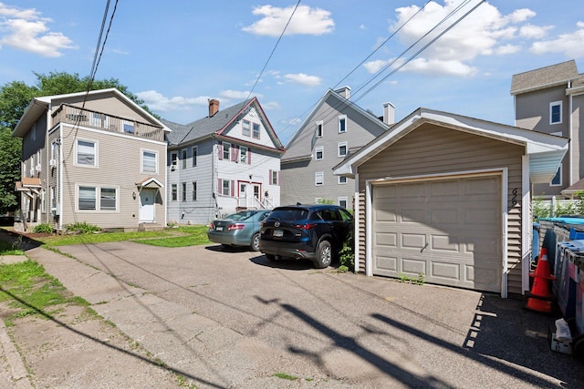 exterior space with an outbuilding and a garage