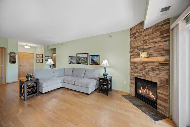 630 Main St N Unit 202, Stillwater, MN 55082 - living area with light wood-style flooring and a stone fireplace