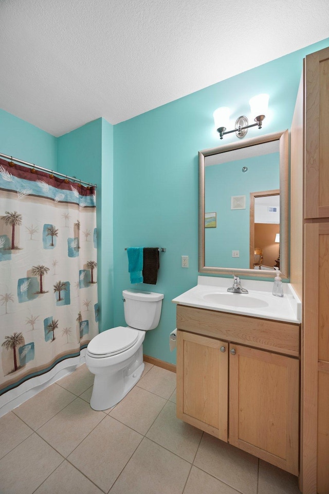 630 Main St N Unit 202, Stillwater, MN 55082 - full bathroom featuring toilet, vanity, a textured ceiling, tile patterned floors, and a shower with curtain